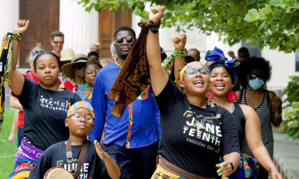 Members of Visual Movement, based in East St. Louis, Illinois, lead a march from the Old Courthouse to the riverfront during the 2nd Annual Juneteenth Commemoration on June 19, 2021. Photo by Wiley Price | St. Louis American