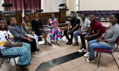 Monifa McKnight (center) meets with some of the African Methodist Episcopal students studying at Africa University. McKnight, a lay member of the African Methodist Episcopal Church, is the first non-United Methodist to sit on the executive board of Africa University (Tennessee) Inc. The meeting held in the Kwang Lim Chapel enabled McKnight to interact with students who are members of her denomination. Photo courtesy of McKnight.