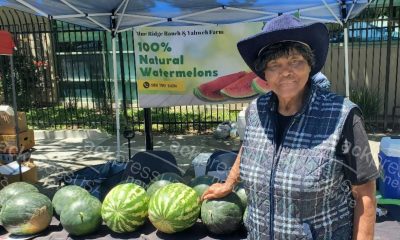 Agricultural Engineer Effie Gant displays watermelons from her Sacramento farm at the Temescal Festival in Oakland. Photo by Carla Thomas.