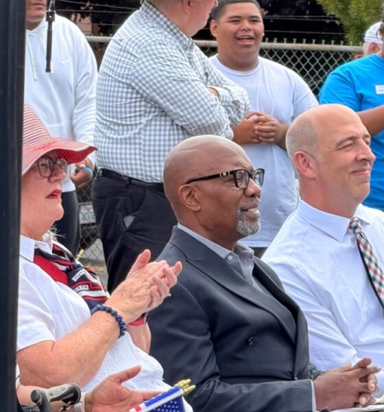 Pastor Michael Wallace of Mt. Zion Missionary Baptist Church (center) and David Kimball, president of the Oakland Stake of the LDS church listen to remarks before volunteers began their work. “We are grateful to partner with these organizations to help care for those in need in our community,” Kimball later told the assembled volunteers. Courtesy photo.