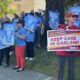 Staff and family members of patients at UCSF Benioff Children's Hospital Oakland in Oakland, Calif., hold signs during a rally on Thursday, July 9, 2026. Rally participants protested the relocation of specialized care clinics to the hospital's San Francisco campus. Photo by Kayla Chan/Bay City News.