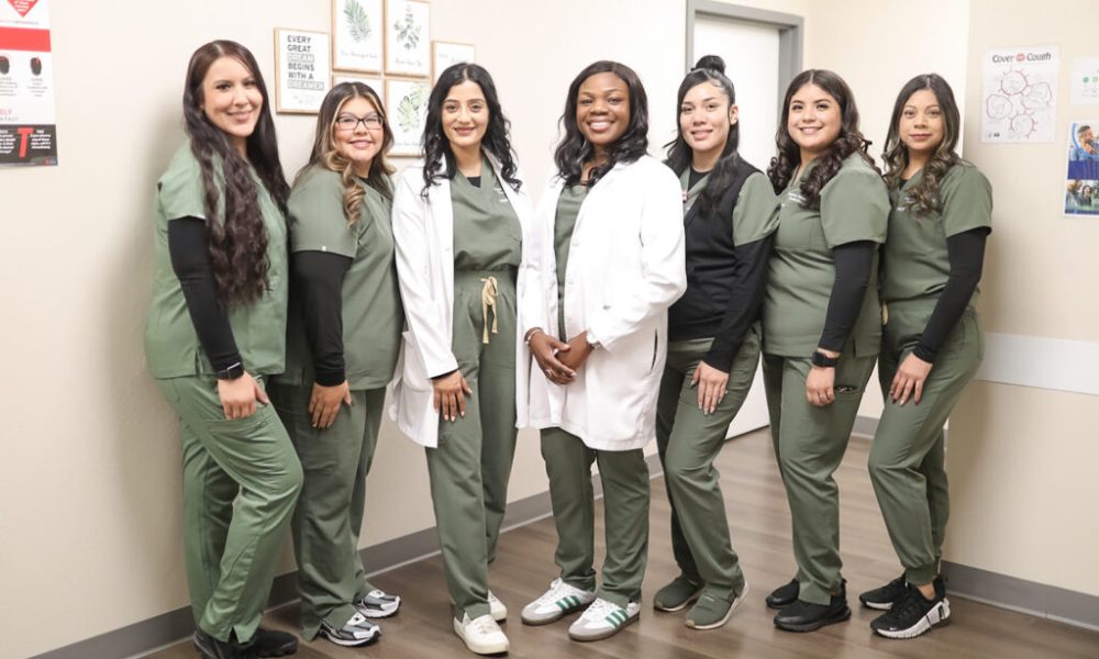 Dr. Ololade Oladimeji and her team pose at Peridot Health Medical clinic in McFarland, which Oladimeji opened just a year ago. "Patients are grateful to have us here."