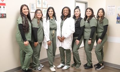 Dr. Ololade Oladimeji and her team pose at Peridot Health Medical clinic in McFarland, which Oladimeji opened just a year ago. "Patients are grateful to have us here."