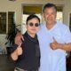 Enoch Shin, left, operator of an auto body shop on International Boulevard in Oakland, with City Councilmember Ken Houston, right, at the Oakland City Council meeting on Tuesday.