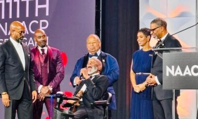Rev. Dr. Amos C. Brown speaks after receiving the Spingarn Medal from Rev. Dr. Frederick D. Haynes III, left, as actor Morris Chestnut, second from left and Brown’s children, Kizzie Brown-Duah, second from right and David Brown, right, look on.