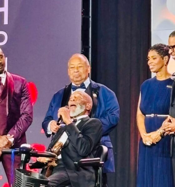 Rev. Dr. Amos C. Brown speaks after receiving the Spingarn Medal from Rev. Dr. Frederick D. Haynes III, left, as actor Morris Chestnut, second from left and Brown’s children, Kizzie Brown-Duah, second from right and David Brown, right, look on.