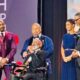 Rev. Dr. Amos C. Brown speaks after receiving the Spingarn Medal from Rev. Dr. Frederick D. Haynes III, left, as actor Morris Chestnut, second from left and Brown’s children, Kizzie Brown-Duah, second from right and David Brown, right, look on.
