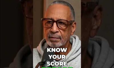 Man checking credit score on phone, emphasizing importance before car purchase.