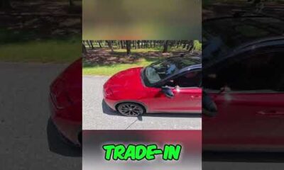 Man locking car door with price tag on it - car buying secret revealed