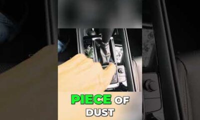 Glossy black piano trim on a car dashboard, showing a secret dealership technique.