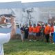 Larry Smith takes a photo during the Common Ground Community Car Show & Block Party celebrating 80 years of Collier Brothers Auto Body and the unveiling of a mural honoring the historic Black owned St. Louis business at 4561 Delmar Blvd. Lawrence Bryant | St. Louis American