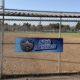 A banner commemorates the 50th anniversary of Frat Games at Darby Park in Inglewood, Calif., on Saturday, July 25. The annual event brings together members of the Divine Nine for fellowship, competition and community. (Daniele Lawson / L.A. Sentinel)