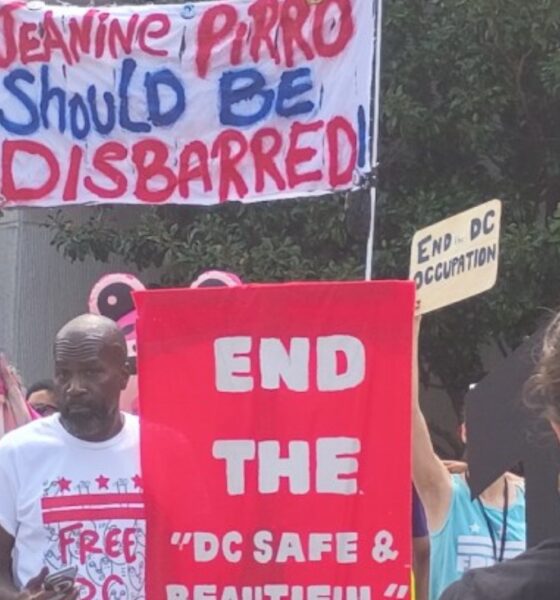 Jerome Hinkle counts among those who stood outside of D.C. Superior Court with signs in hand against U.S. Attorney for the District of Columbia Jeanine Pirro. (Sam Plo Kwia Collins Jr./The Washington Informer)