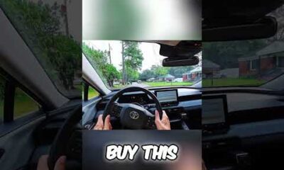 Toyota RAV4 Hybrid driving smoothly on a rough road, showcasing its suspension capabilities.
