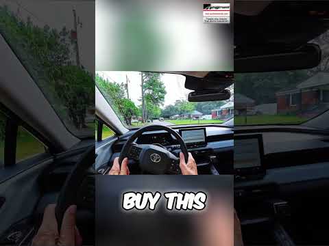 Toyota RAV4 Hybrid driving smoothly on a rough road, showcasing its suspension capabilities.