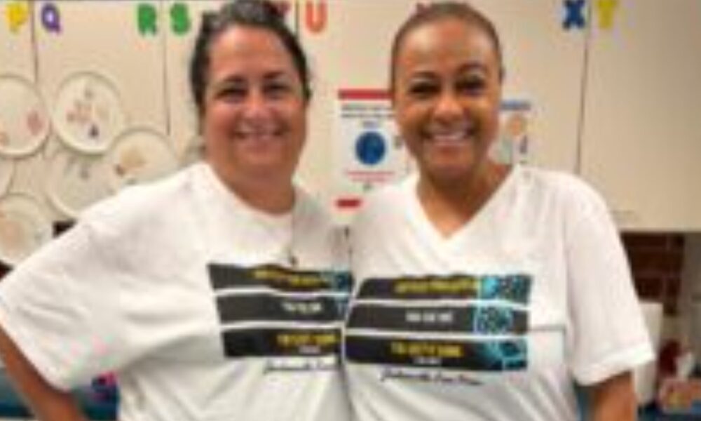 Pictures are Pine Forest School of the Arts teachers Laura Hammock, left, and Tanya Bolden wearing their Jacksonville Free Press "Keep Your Head Up' shirts in support of the Journalism Fund.