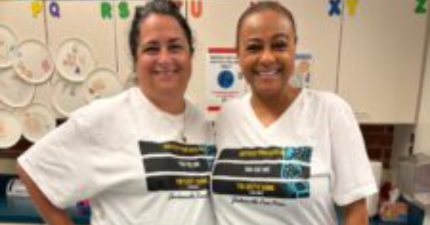 Pictures are Pine Forest School of the Arts teachers Laura Hammock, left, and Tanya Bolden wearing their Jacksonville Free Press "Keep Your Head Up' shirts in support of the Journalism Fund.