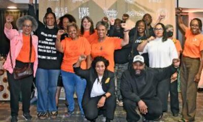 Imani Social Justice Team (left to right): Angela Noel, Zakiya Jendayi and Diane Doss. Patty Hallm, Susan Burns, Diane Lewis, Pastor Michael McBride, Theresa ???, Jean Moses and Diana Bell. Front: Sloane Johnson and (man whose name I'm getting to complete the identification). Photo by Octavian Kelly.