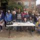 Zakiya Jendayi, center, surrounded by supporters at the weekly gathering at her house to halt her eviction. Photo by Tanya Dennis.