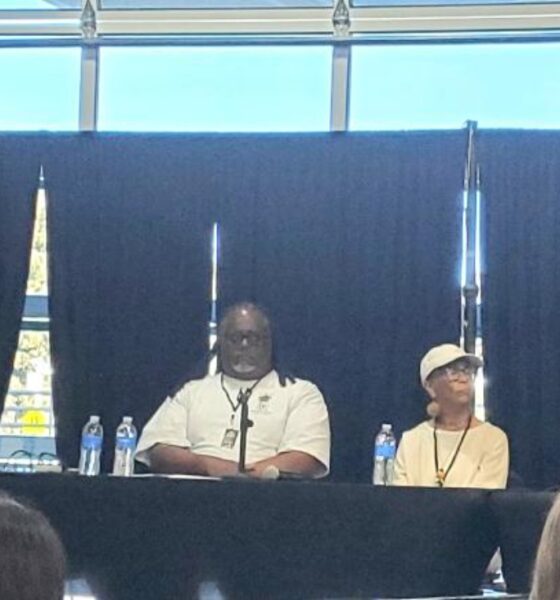 Quixote Atkins of VillageGIVE moderates a panel discussion at the Coliseum 60 celebration at Youth UpRising featuring Keith Brown, a member of IATSE Local 107; author, historian and former Black Panther Party member Tareka Lewis; and African American Sports and Entertainment Group President Ray Bobbitt.