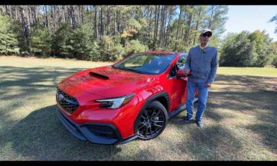 2026 Subaru WRX parked on a scenic road, front view showcasing the modern sports sedan design for a daily driver review.