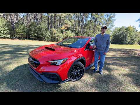 2026 Subaru WRX parked on a scenic road, front view showcasing the modern sports sedan design for a daily driver review.