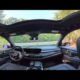 Interior view of 2027 Buick Enclave Sport Touring showing dashboard, leather seats, and infotainment touchscreen.
