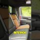 Person sitting in a car interior testing windshield visibility and checking cabin space for an auto buying guide.