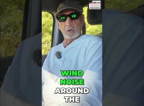 Driver testing vehicle interior cabin comfort and wind noise levels while driving on a highway.
