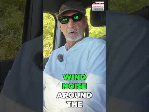 Driver testing vehicle interior cabin comfort and wind noise levels while driving on a highway.