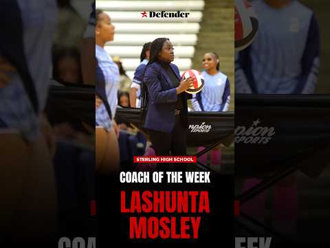Lashunta Mosley, Houston Defender Coach of the Week, smiling and wearing a branded team polo shirt on a sports field.