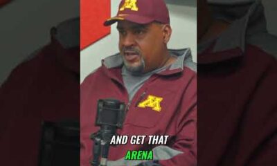 Minnesota Gophers basketball coach Ben Johnson standing on the court at Williams Arena, The Barn, during a home game.