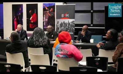 Hennepin County Attorney debate stage with candidates and moderator at the BlackPressUSATV studio event.