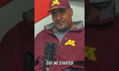 Gopher Sports podcast hosts recording in a studio with Minnesota Golden Gophers team gear and branding in the background.