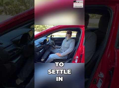 Driver adjusting their car seat position for optimal safety and comfort before driving.