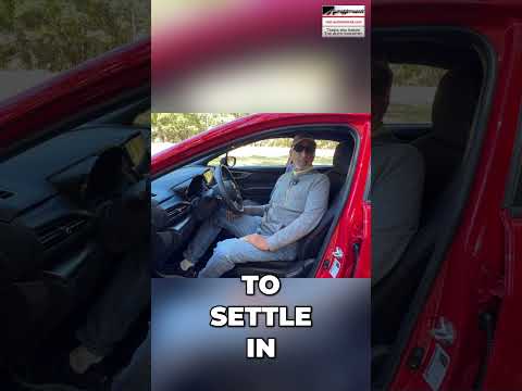 Driver adjusting their car seat position for optimal safety and comfort before driving.