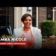 Tamra Nicole modeling a professional dress for success outfit during a Houston Defender Network interview segment.