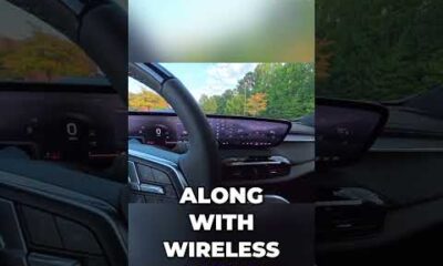 Buick Enclave interior dashboard featuring the large infotainment screen and front view visibility from the driver seat.