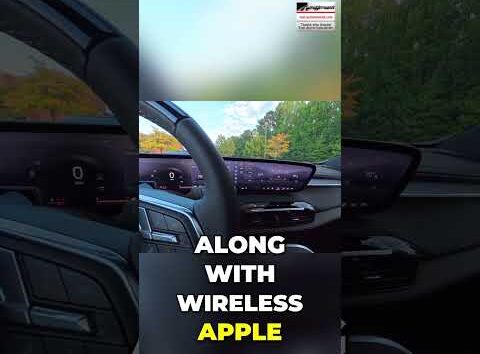 Buick Enclave interior dashboard featuring the large infotainment screen and front view visibility from the driver seat.