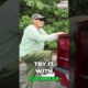 Person standing on a retractable truck bed step to easily reach items in the cargo area of a pickup truck.