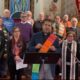 Metro Detroit faith leaders stand behind Rev. Paul Perez of the United Methodist Church downtown Detroit. Photo Samuel Robinson