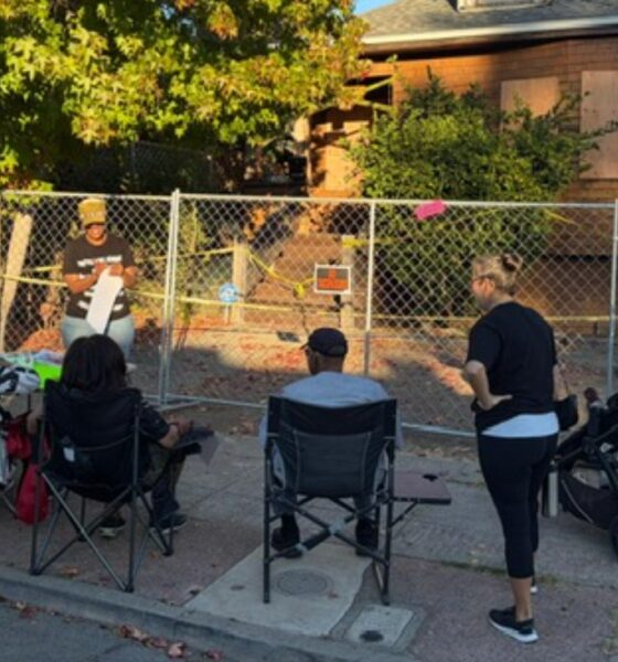 Supporters continue to gather outside the home of Zakiya Jendayi a week after sheriff’s deputies boarded up doors and windows, changed the locks and fenced off the property. Photo by Lindsay Imai Hong.