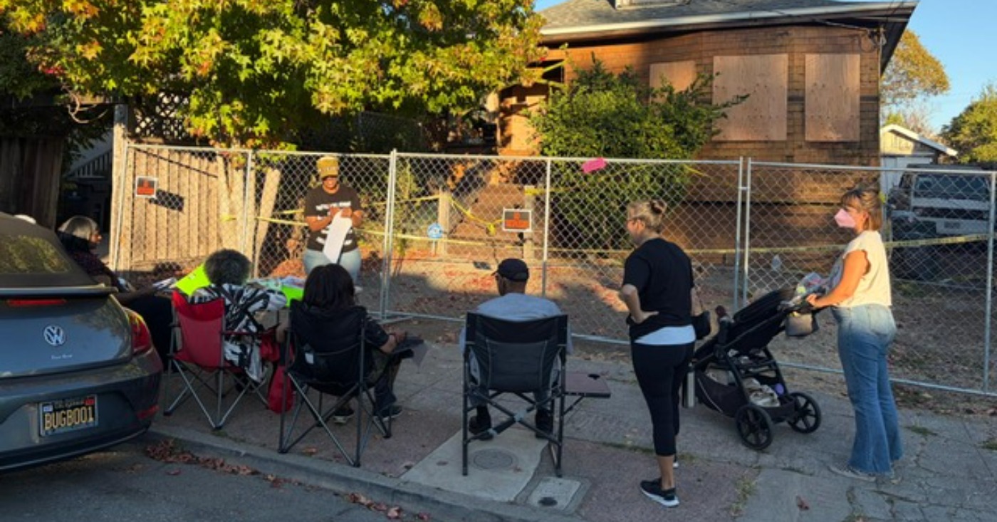 Supporters continue to gather outside the home of Zakiya Jendayi a week after sheriff’s deputies boarded up doors and windows, changed the locks and fenced off the property. Photo by Lindsay Imai Hong.
