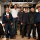 Joel Young with bus union workers. Courtesy photo.