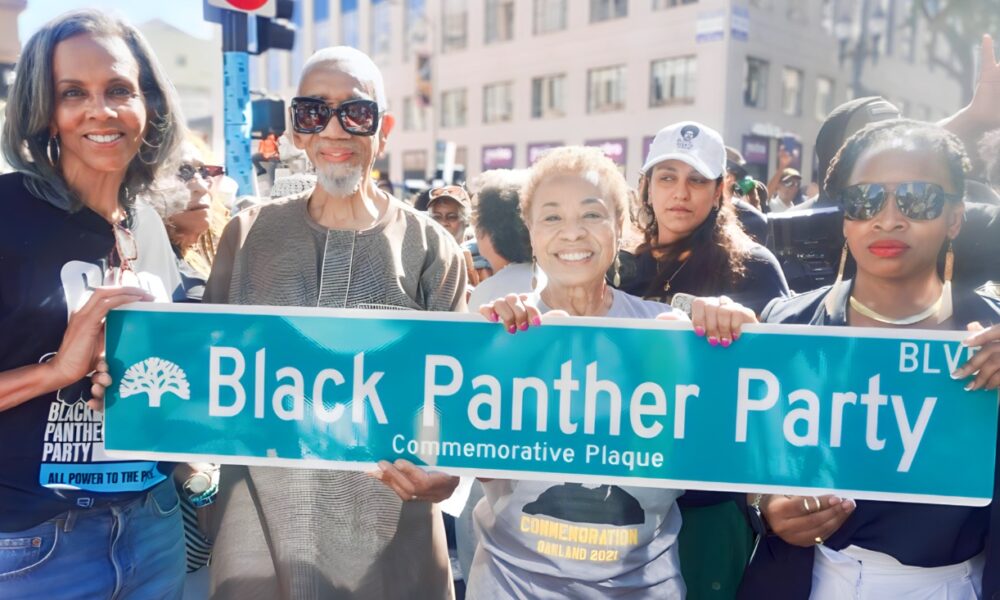 A portion of Broadway from 14th to 17th street was renamed Black Panther Party Boulevard as part of the 60th anniversary of the party’s founding, which was Oct. 15, 1966. Present were (from left) Fredrika Newton, former U.S. Rep. Bobby Rush (the only BPP member elected to Congress); Oakland Mayor Barbara Lee, and District 3 City Councilmember Carroll Fife. Newton, widow of BPP co-founder Huey P. Newton, co-founded the foundation that bears his name as well as the Black Panther Party Museum that is now on BPP Boulevard. Earlier this year, a street was named for BPP co-founder Bobby Seale at 57th and Martin Luther King Jr. Way. Courtesy photo.