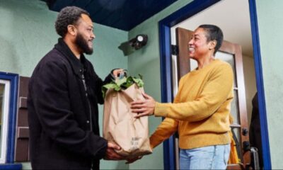 A client receives groceries from a member of Urban Tilth. Courtesy photo.