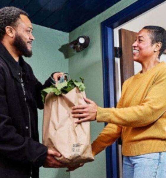 A client receives groceries from a member of Urban Tilth. Courtesy photo.