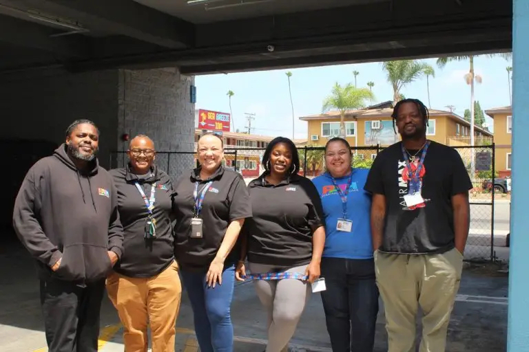 Courtney Reed, associate director at People Assisting the Homeless, with her team at the Los Angeles Inn in Inglewood. Photo by Marion Apio