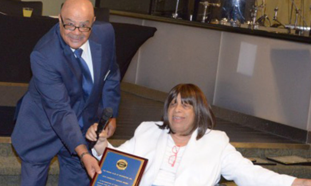 Anita "Ma" Vance receives the Pigskin Club Exceptional Community Service Award. (Photo by Maurice Pierce)