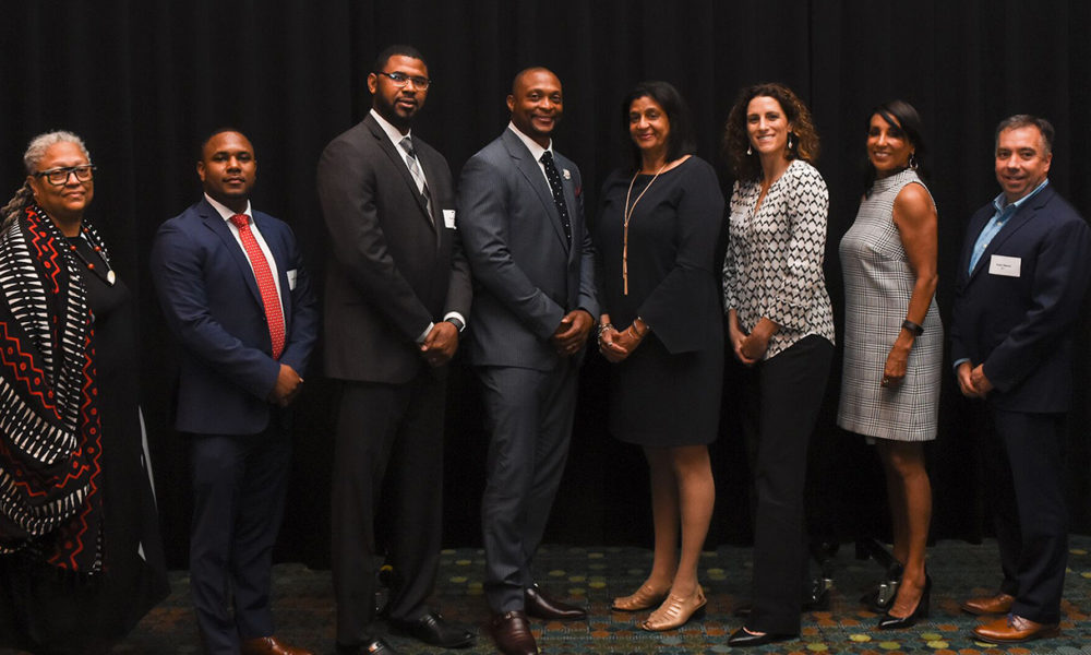 At the fourth annual Francis S. Guess Bridge to Equality Fund luncheon Thursday at the Music City Center. Honoree Gail Williams (fifth from l) poses with panelists (from l) Rev. Dr. Emilie M Townes, Robert Sherrill, Shan Foster, Eddie George, Stephanie White, emcee Vicki Yates, and Sean Henry. (photo by Morgan Yingling/CFMT)